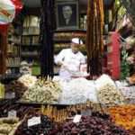 A Turkish vendor sells dates and dried fruits at the Egyptian Bazaar during preparations for the upcoming holy month of Ramadan, in Istanbul